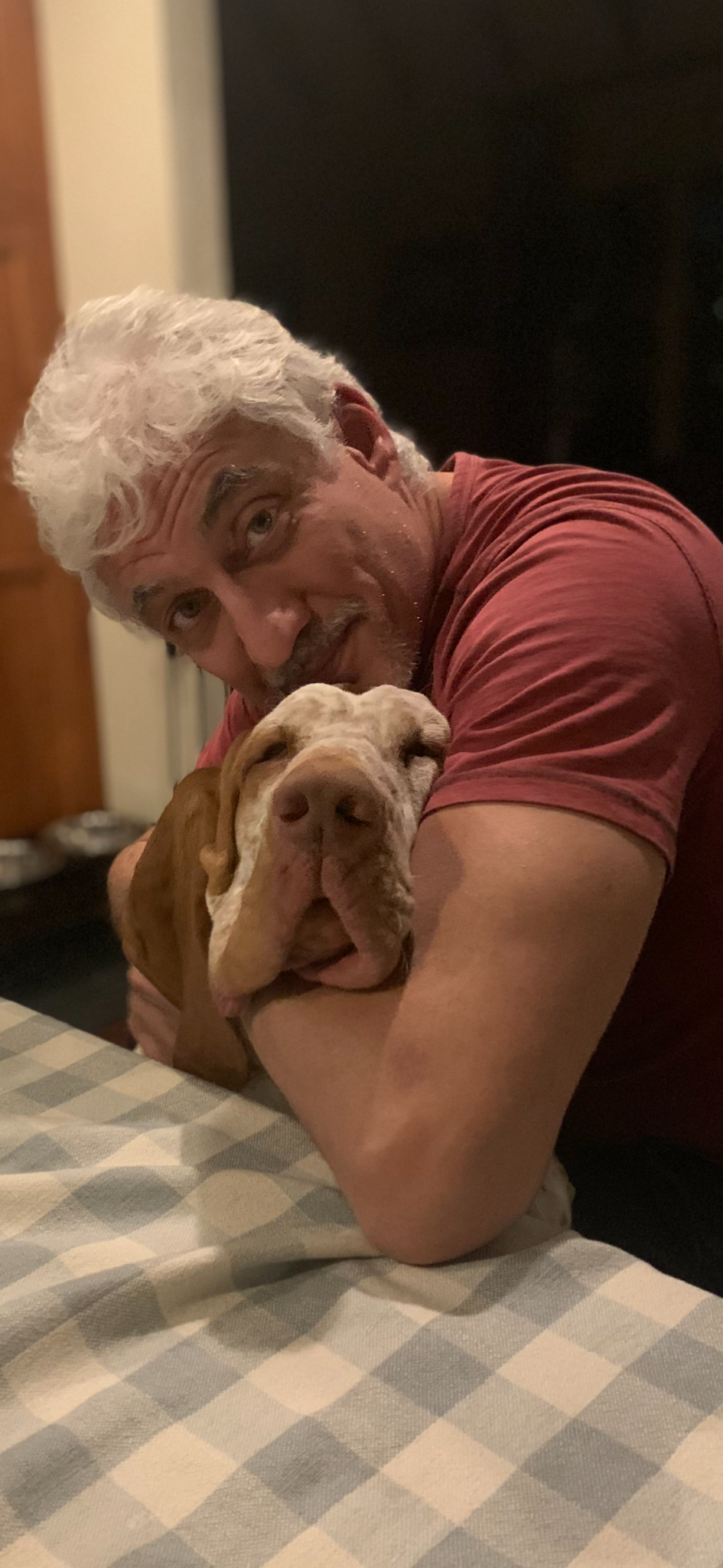 Gianluca Martorelli embracing Dante at home.