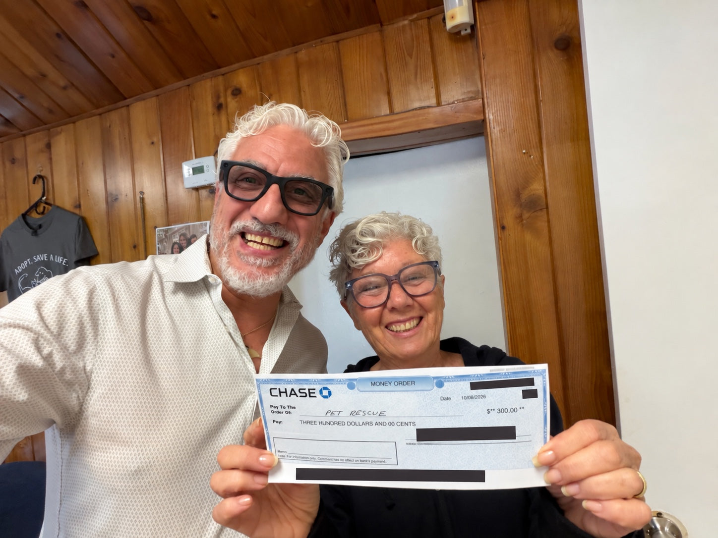 BERAURA founder Gianluca Martorelli and a Pet Rescue representative presenting the $300 contribution together.