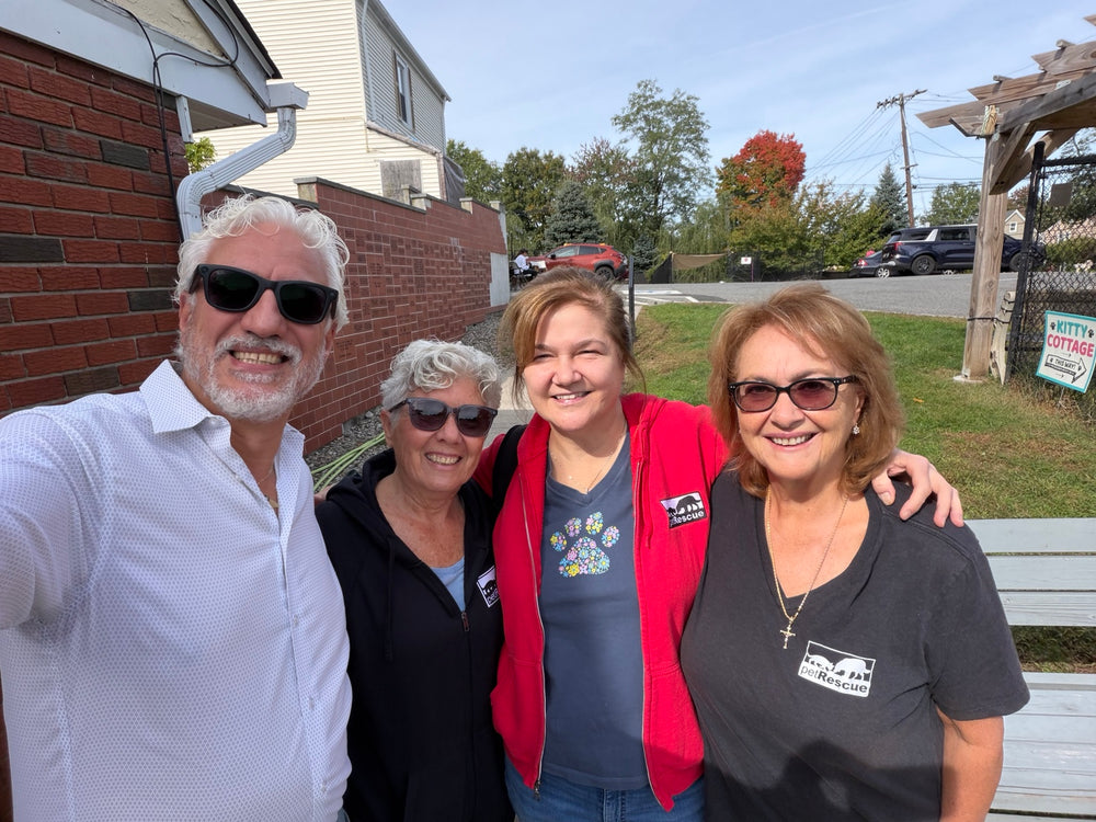 Gianluca Martorelli with three members of the Pet Rescue community outside the rescue.